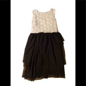 Size 10-12 child size, lacy black and white dress.